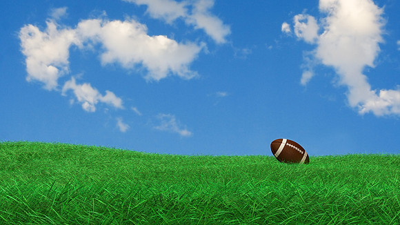 football lying on grass waiting for kick
